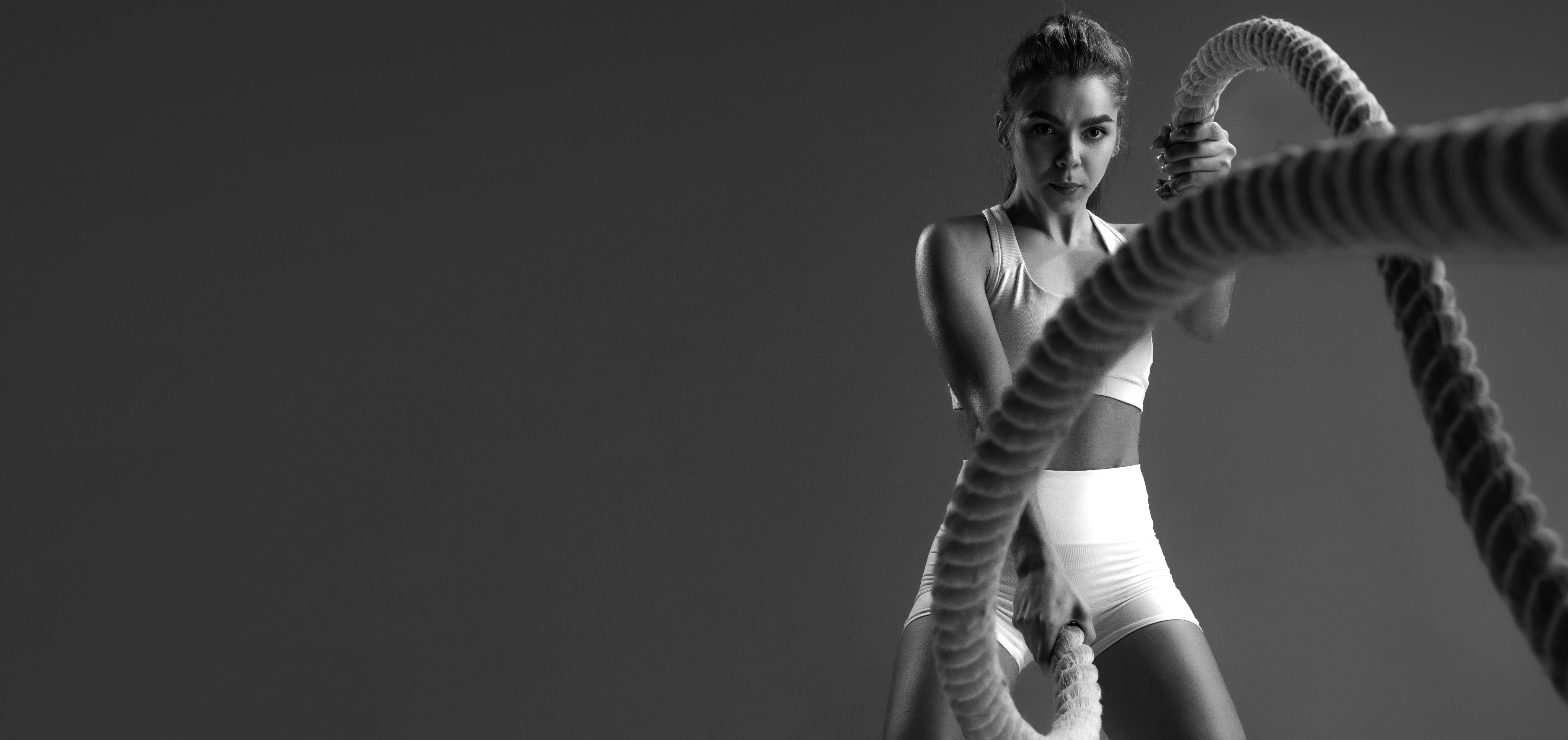 Athlete using battle ropes during a high-intensity workout